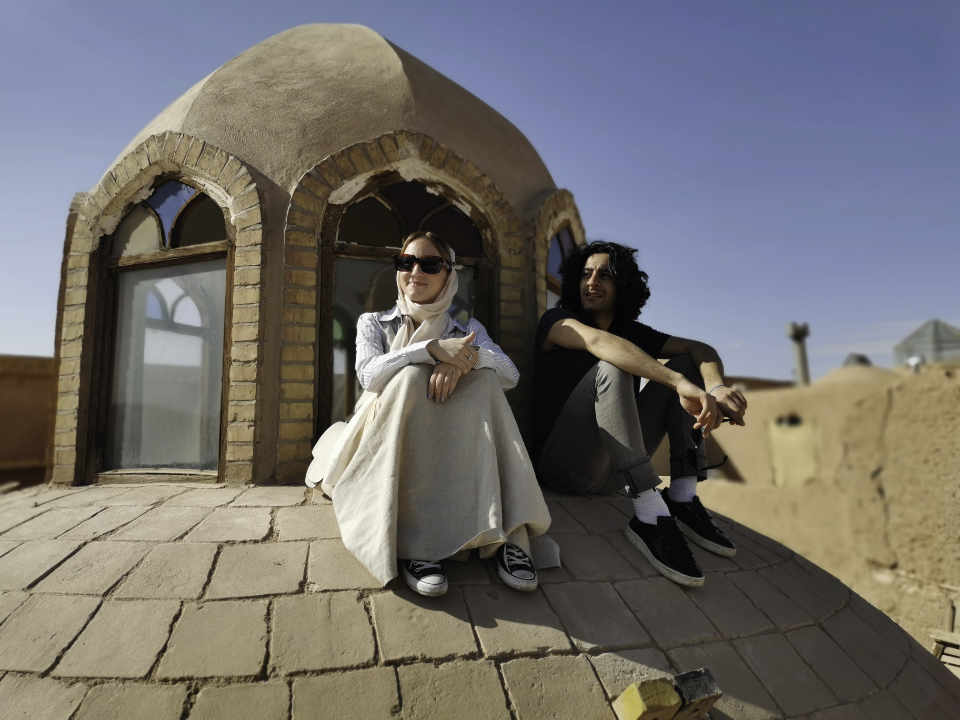 picture of Kayrokh and Paulinba on top of a dome in Yazd
